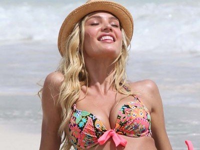Candice Swanepoel occupies the beach