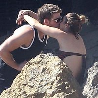 Miley Cyrus posing in tight bikini