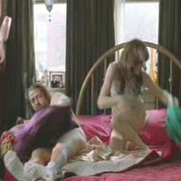 Milla Jovovich posing in sexy lingerie in ‘8.45’