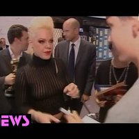 Pink posing in see-through clothes